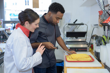 Obraz premium chef cutting parma raw ham