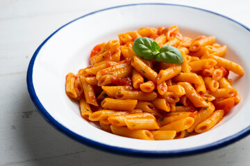 Italian macaroni with tomato and basil sauce.