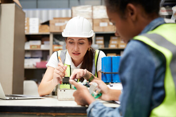 factory workers checking and fixing small machine or mainboard in the factory