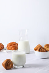 Breakfast tasty food concept - milk with bakery products