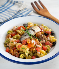 Fresh pasta with vegetables and sardines.