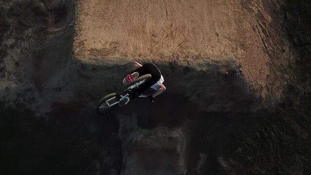 Extreme Sports BMX backflip on a large dirt jump course
