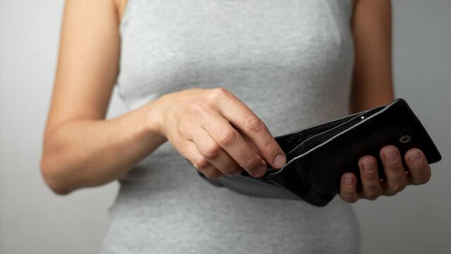Woman hands holding wallet with dollar money