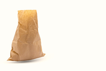 Brown paper bag isolated on white background. 