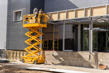 mobile lifting cradle. Construction scissor lift.