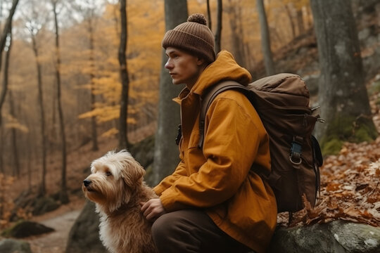 A man with a dog hiking in the autumn forest, AI