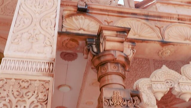 artistic hand carved red stone jain temple at morning from unique angle video is taken at Shri Digamber Jain Gyanoday Tirth Kshetra, Nareli Jain Mandir, Ajmer, Rajasthan, India.