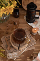 Still-life with a cup of tea, sunflowers and gerbera