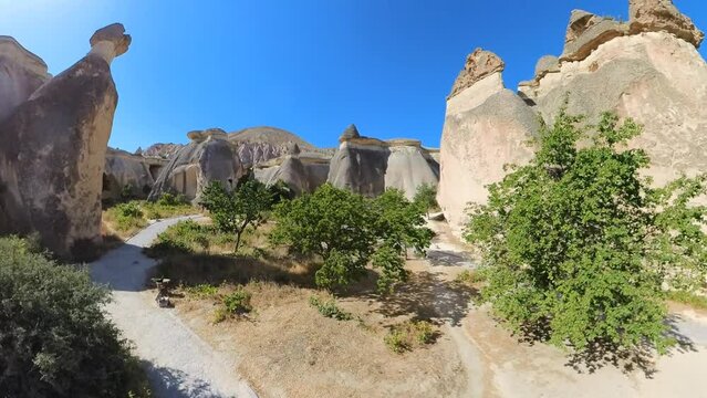 The Fairy Chimneys of Cappadocia, Turkey, is a natural wonder, whimsical geological formations, shaped by centuries of erosion, resemble tall, slender chimneys or whimsical mushrooms.