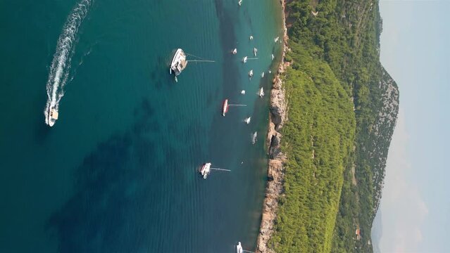 Aerial of Croatian island rocky shore. Shot in 9x16 aspect ratio for social media.