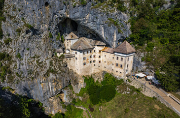Fototapeta na wymiar Aerial view of Pradjama Castle and village. Postojna Slovenia