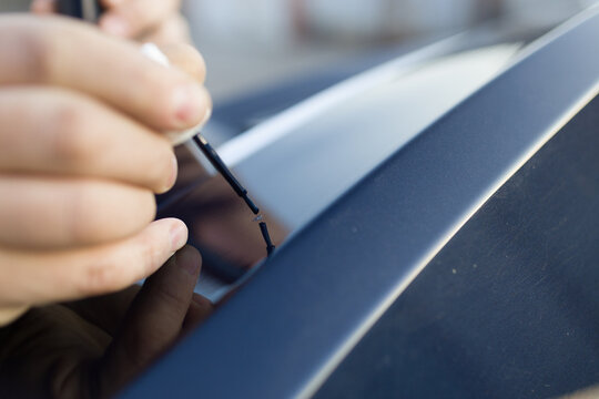 Brush painting small scratches chipped car vehicle detailing paint lacquer