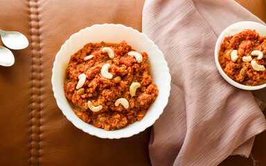 Gajar Halwa or Carrot Halwa is a traditional Indian dessert garnished with almond,raisins,nuts.Top...