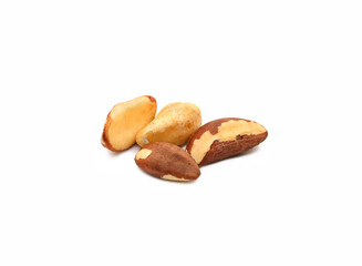 Delicious Brazil nuts isolated on white background. Group of tasty healthy ripe shelled Brazil nuts. Organic product. Side view. Selective focus.