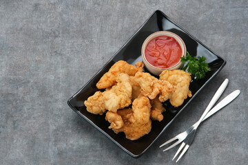 Crispy chicken fillets (ayam goreng tepung) with chilli sauce
