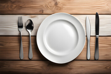 White empty dinner plate with fork and knife setting on wooden table top view, restaurant dinner concept 