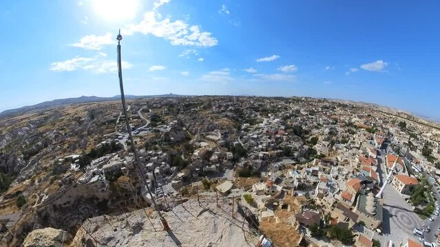 Ortahisar Castle in Cappadocia, Turkey, is a historic fortress perched atop a rock formation. It boasts stone walls, tunnels, and chambers, offering a window into its centuries-old past.