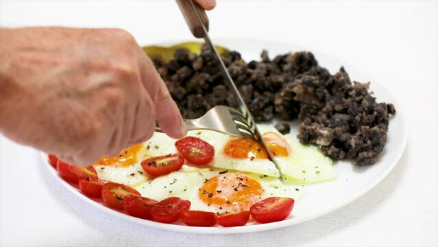 Traditional Brazilian food known as "virado com ovo" made with black beans and corn flour