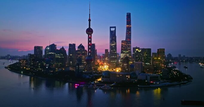 Aerial photography of Shanghai city skyline at dawn. Advertising and trademark removed creative video