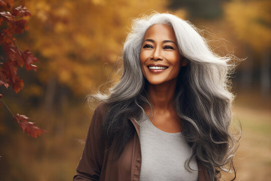 Generative AI technology picture of gorgeous grey haired woman walking autumn park