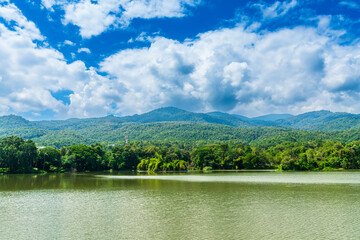 a public place leisure travel landscape lake views at Ang Kaew Chiang Mai University and Doi Suthep nature forest Mountain views spring cloudy sky background with white cloud.