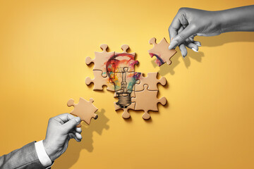 A sketched light bulb on the puzzle pieces - idea development concept