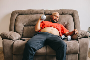 Lazy overweight man training at home. Weight loss concept. - obrazy, fototapety, plakaty