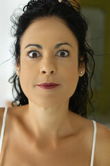 Naklejka premium Confident Young Woman with Curly Hair and Attractive Features