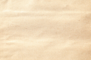 Brown crumpled paper texture with grains macro closeup