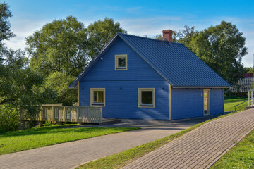 Fototapeta na wymiar Blue wood house with blue roof.