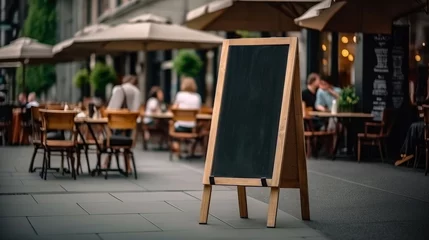 Fotobehang Empty blackboard sign mockup in front of a restaurant , Menu board with a street cafe or restaurant © Atchariya63