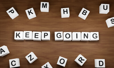 Keep going, white dice with dark capital letters on a table. Motivation, continuity,  inspiration, cool attitude. 3D illustration