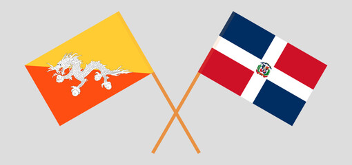 Crossed flags of Bhutan and Dominican Republic. Official colors. Correct proportion
