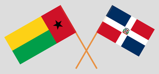 Crossed flags of Guinea-Bissau and Dominican Republic. Official colors. Correct proportion