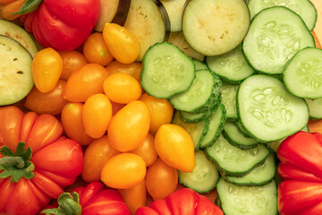 Mixed fresh vegetable background. Healthy eating ingredients. Slice of mix veggies, tomatoes,...
