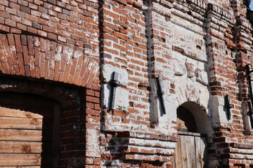 Church and destroyed red brick building in the village of Kolentsy, Ryazan region
