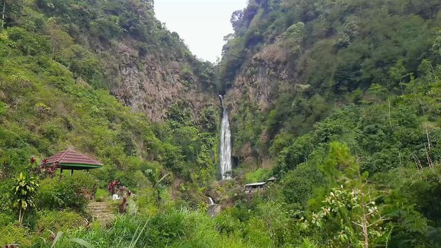 Curug Bajing Waterfall seen from a distance