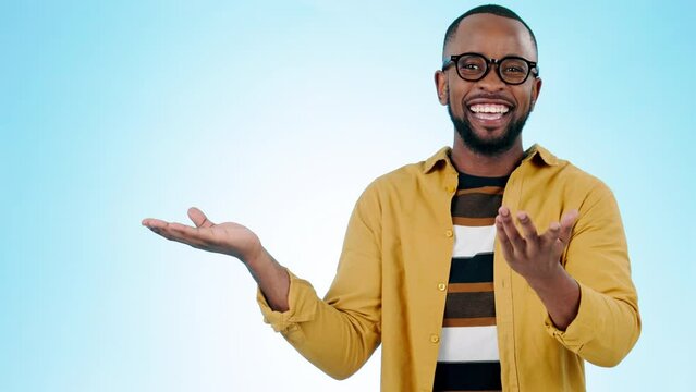 Black man, pointing at mockup and advertising presentation, information or news with ambassador on blue background. Portrait, hand palm and launch announcement with marketing and logo in a studio