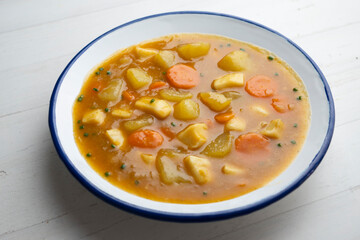 Strips of squid stewed with potatoes, vegetables and broth.