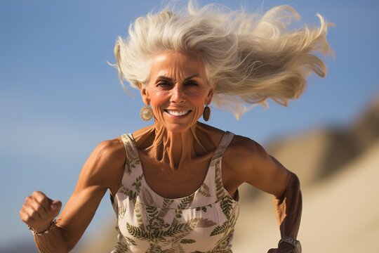 Laughing Cheerful Blonde Woman With A Sense Of Humor Standing On The Beach, Older Woman Enjoying Life