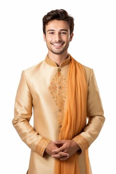Handsome Young Man in Traditional Indian Attire, Achkan and Churidar Reflect Sophistication and Authenticity, Confident Smile and Engaging Eyes Radiate Captivating Charm, Isolated on White Background