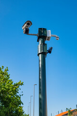 Security camera on the public road. Surveillance with security cameras on the street for the safety of citizens.