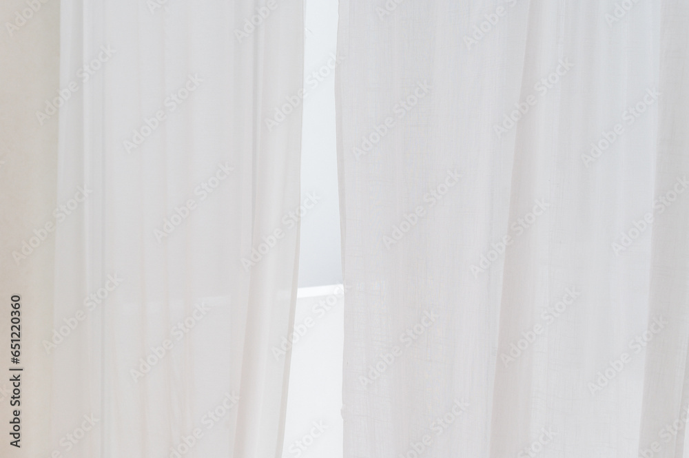 Poster transparent curtain on window. white curtain wavy with a pattern background. real photo