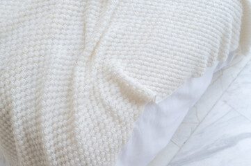 closeup white bed sheet with weave texture