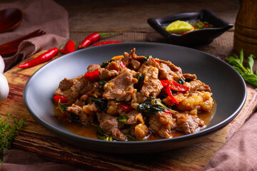 Stir fried sliced Beef with Holy Basil in white plate.Thai famous food (Pad Kra pao)