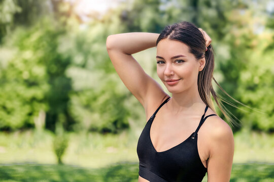 close up portrait of a athletic woman in the park. Sports, workout outdoors