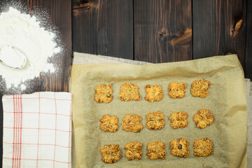 Homemade cookies in the oven, on the table. Homemade freshly baked gingerbread cookies on a rustic wooden table. Selective focus. Copy space