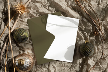 Christmas card mockup with green envelope 