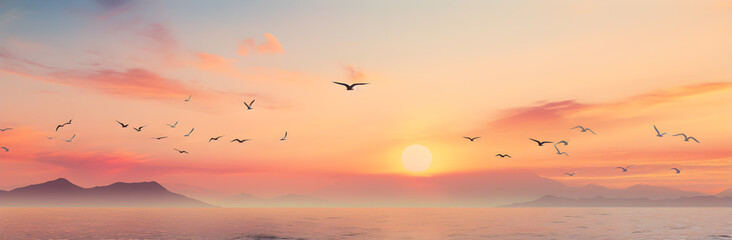 Obraz premium Mesmerizing Sunset with Soaring Seagulls in Light Pink and Aquamarine
