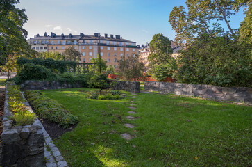 Small park, in the district Södermalm, cumulus clouds, a sunny autumn day in Stockholm